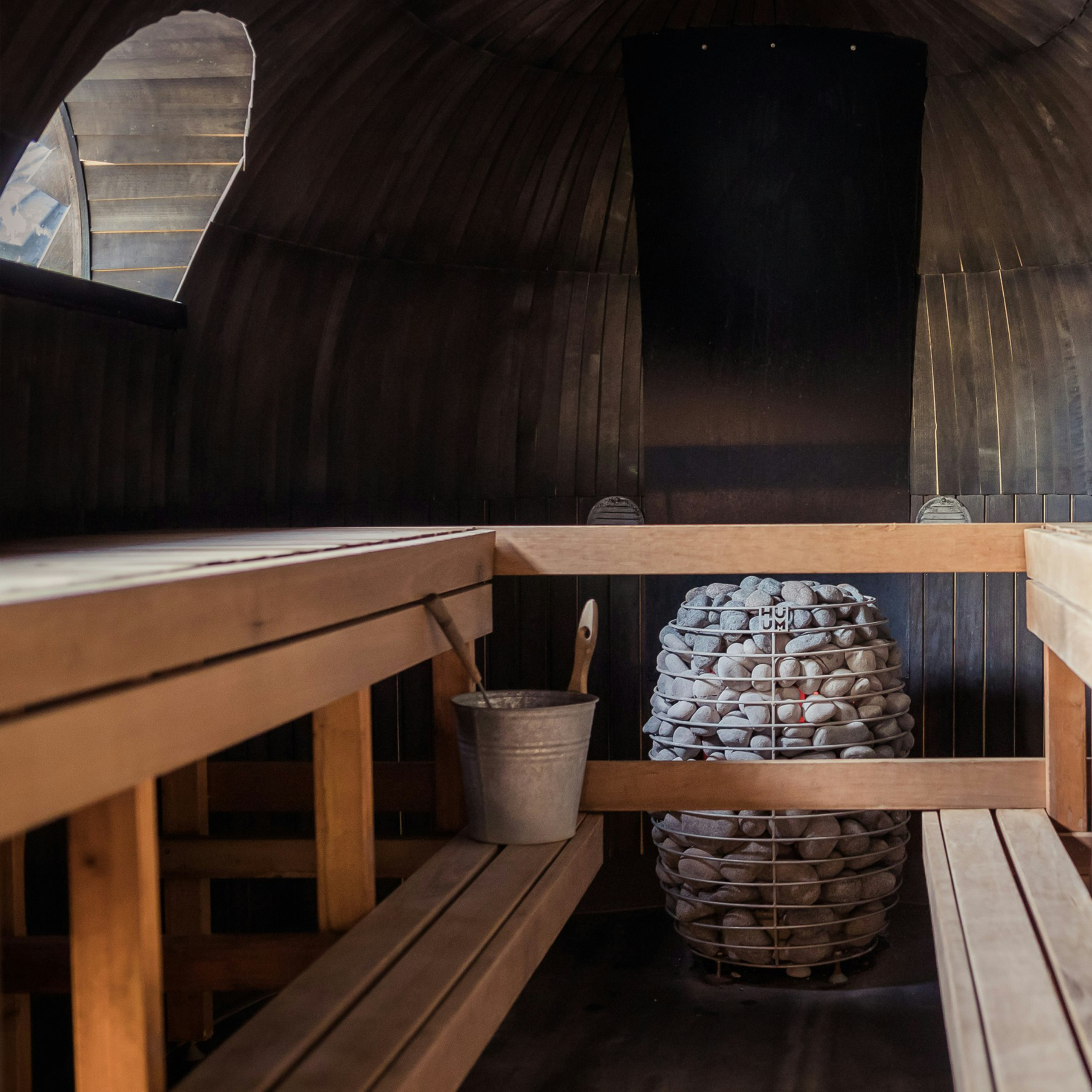 Interior of a sauna with wooden benches.