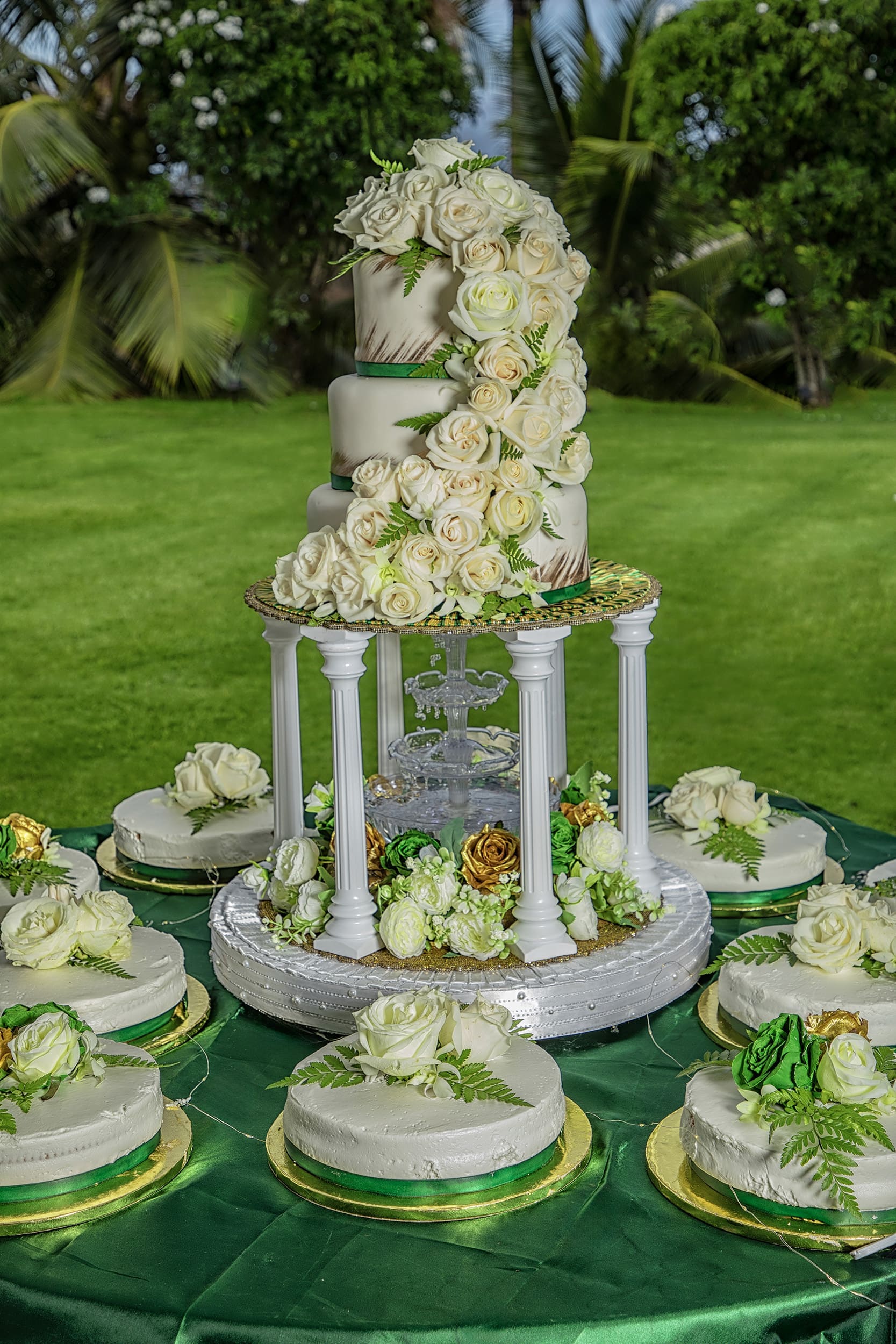 Elegant wedding cake adorned with white roses.