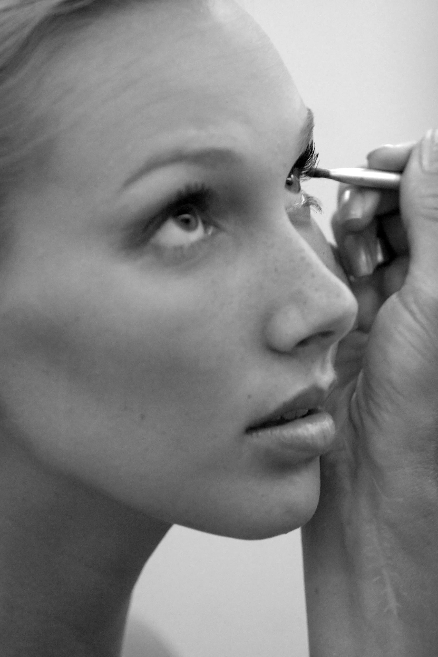 Close-up of eye makeup application process.