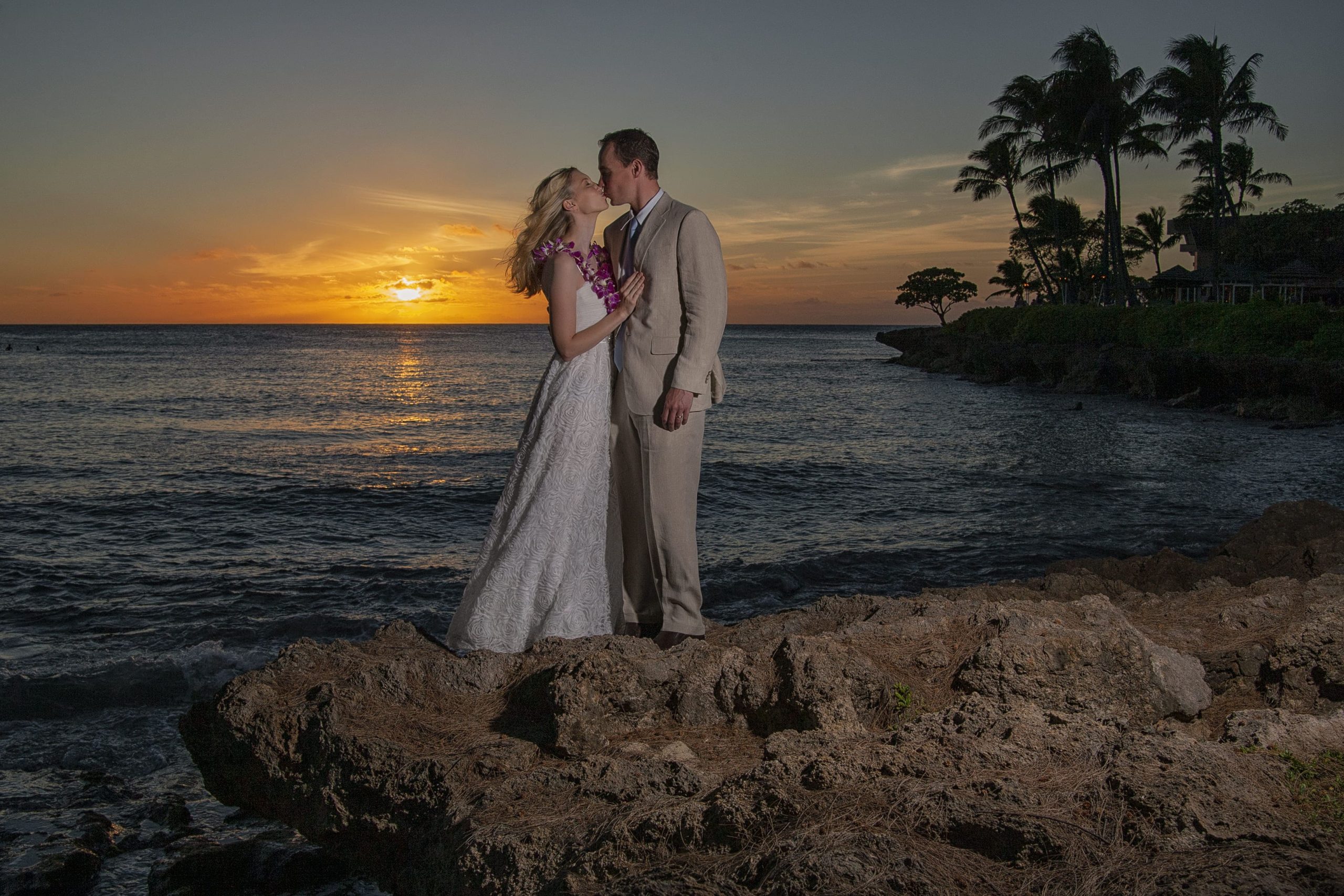 Couple kissing at sunset on the beach