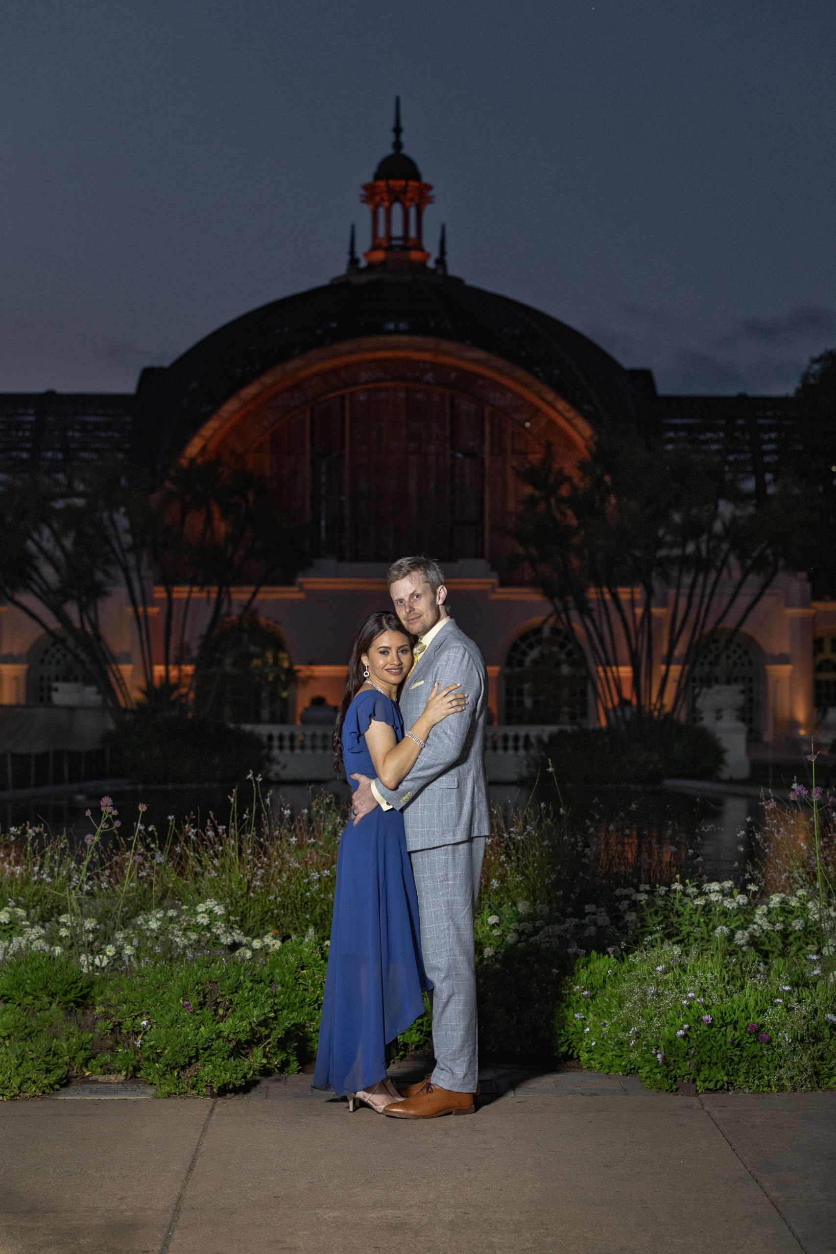 Couple embracing in a beautiful evening setting.